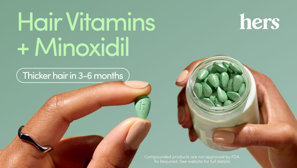 Hands holding a jar and a single green hair vitamin, with text promoting "Hair Vitamins + Minoxidil" for thicker hair in 3-6 months by Hers.