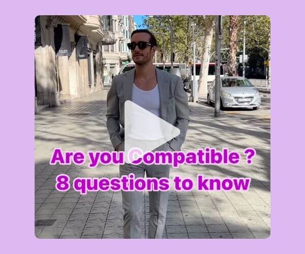 A man in a light gray suit and sunglasses walks confidently down a city street. Overlaid text reads, “Are you Compatible? 8 questions to know,” with a play button in the center, indicating it’s a video. The background has a light purple border.