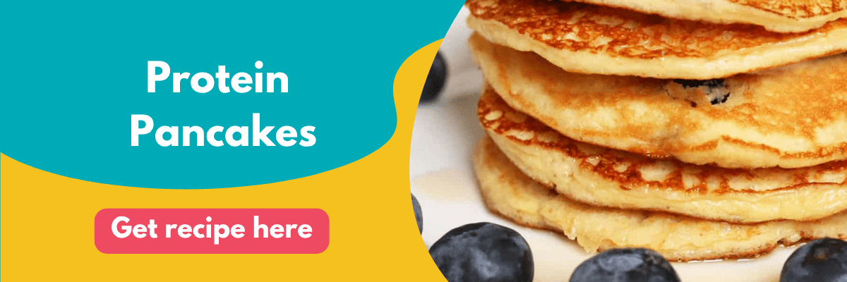 A close-up of fluffy protein pancakes stacked on a plate with blueberries around them. The left side of the image has a bright teal and yellow background with the text “Protein Pancakes” and a pink button that says “Get recipe here.”