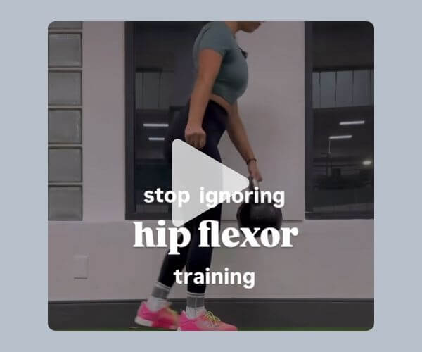 A woman in athletic wear stands indoors holding a kettlebell, with text on the image reading “stop ignoring hip flexor training.” A play button overlay suggests it’s a video.