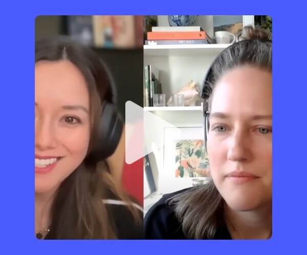 Split-screen video call of two women wearing headphones, one smiling and the other listening, with a blurred home office background.