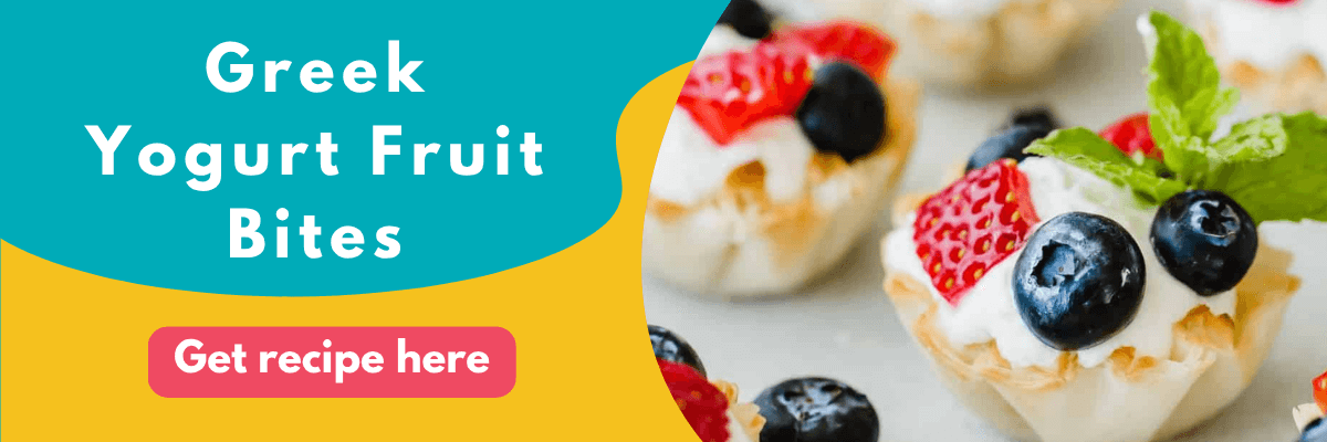 Banner showing Greek Yogurt Fruit Bites topped with blueberries, strawberries, and mint leaves, alongside text that reads “Greek Yogurt Fruit Bites” and a pink button that says “Get recipe here.