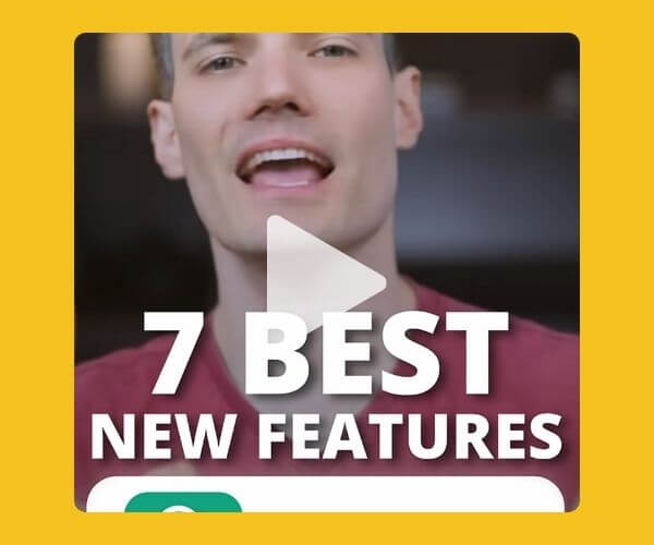 Video thumbnail of a man speaking, overlaid with bold white text that reads "7 BEST NEW FEATURES" with a large play button icon in the center. The background is framed with a mustard yellow border.
