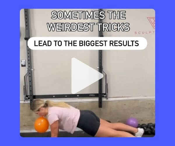 Video still of a woman doing a plank with small colorful balls under her chest and hips, with the text: “Sometimes the weirdest tricks lead to the biggest results,” suggesting an unconventional fitness hack.