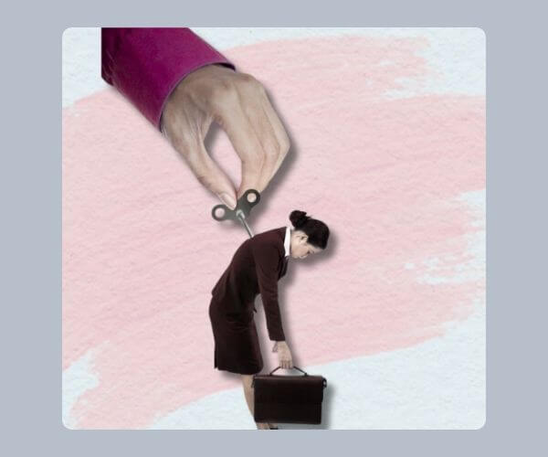 Surreal image of a tired-looking businesswoman with a wind-up key in her back, being wound up by a giant hand—symbolizing burnout or the feeling of being mechanically driven at work.