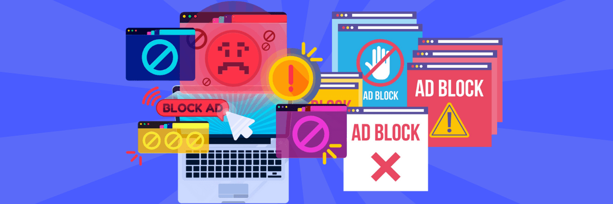 A laptop is surrounded by a chaotic mix of brightly colored pop-up windows and warning icons, all shouting “Ad Block” or displaying blocked-ad symbols.