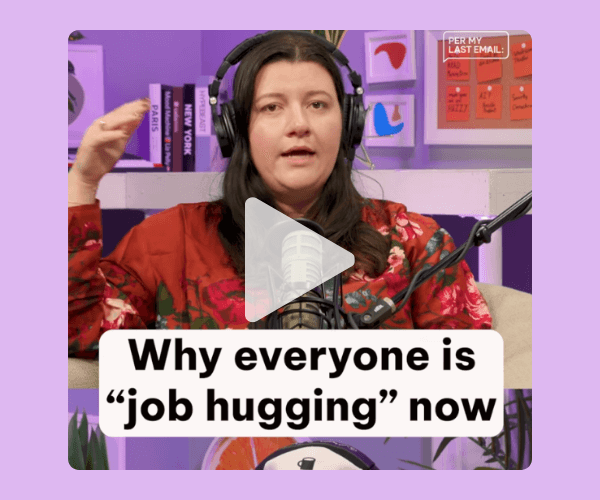 A woman wearing large headphones and a floral red top speaks into a studio microphone, with the overlaid caption “Why everyone is ‘job hugging’ now” centered at the bottom of the video frame.