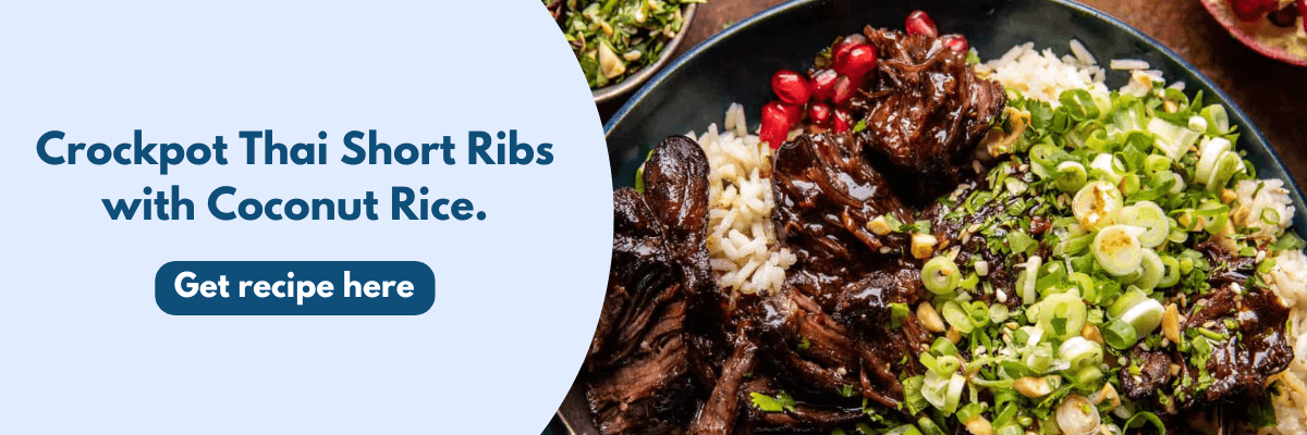 A plate of crockpot Thai short ribs is served with fluffy coconut rice, fresh green onions, and bright pomegranate seeds. The left side of the image features text promoting the recipe with a button that says “Get recipe here.”