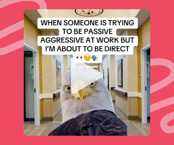 A bald eagle faces the camera in a beige office hallway with framed art and doors on both sides, overlaid with a white play button and bold caption text about being direct at work. The image sits inside a bright red graphic background with wavy lighter-red shapes, creating a bold, meme-style overlay.