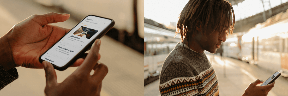 Hands hold a smartphone while standing on a sunlit train platform, with blurred tracks and trains in the background. The person looks down at the screen as warm golden light fills the station.