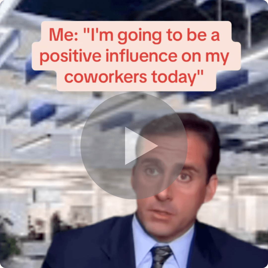 Text reads, “Me: ‘I’m going to be a positive influence on my coworkers today’” over a reaction shot of a man in an office setting, with a play button overlay suggesting a humorous video.