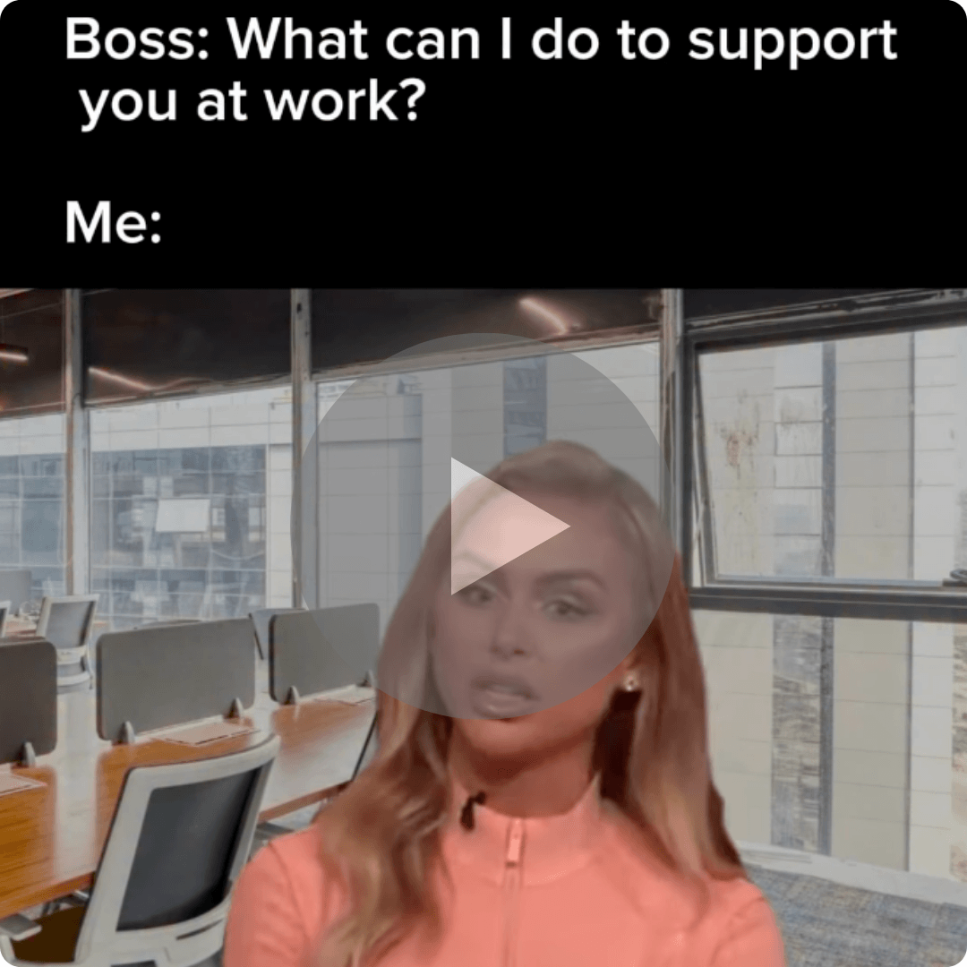 Text reads, “Boss: What can I do to support you at work? Me:” over a reaction shot of a woman in an office setting, with a play button overlay indicating a humorous video.