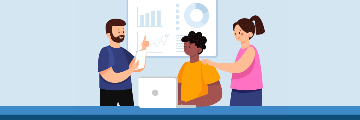 A small team stands around a laptop as one person presents ideas while another offers a reassuring hand on a colleague’s shoulder, suggesting collaboration and support.