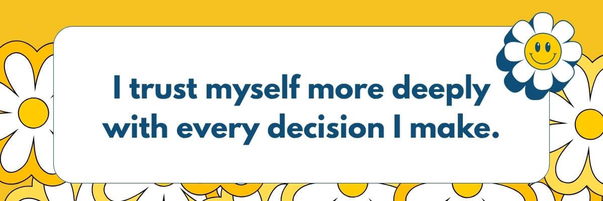 A motivational graphic displays the affirmation, “I trust myself more deeply with every decision I make.” White daisies with yellow centers surround the text on a bright yellow background.