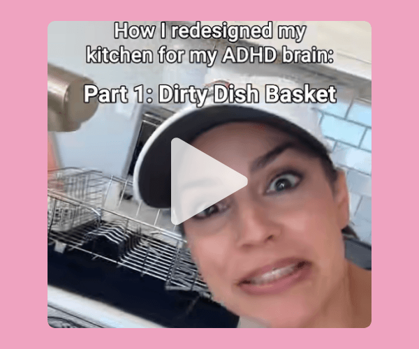 A video thumbnail shows a woman in a kitchen with a dish rack and sink behind her. Text at the top reads, “How I redesigned my kitchen for my ADHD brain: Part 1: Dirty Dish Basket,” with a large play button in the center.