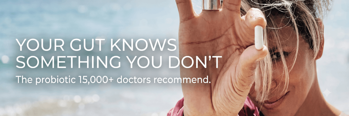 An advertisement shows a person holding a white probiotic capsule between their fingers against a softly blurred outdoor background. Large text reads, "Your gut knows something you don't," followed by, "The probiotic 15,000+ doctors recommend.”