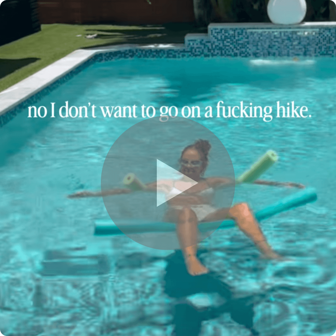 A video thumbnail shows a person relaxing on a pool float in a backyard swimming pool. The text overlay reads, āno I donāt want to go on a fucking hike.ā