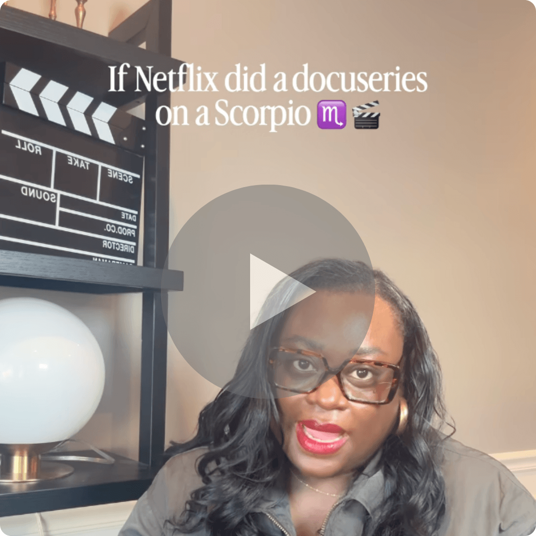 A woman wearing glasses appears in a video frame, speaking toward the camera from a room with warm lighting. Behind her are dark shelves holding a film clapperboard, a round white lamp, and other decorative objects, while text at the top references a Netflix docuseries about a Scorpio.