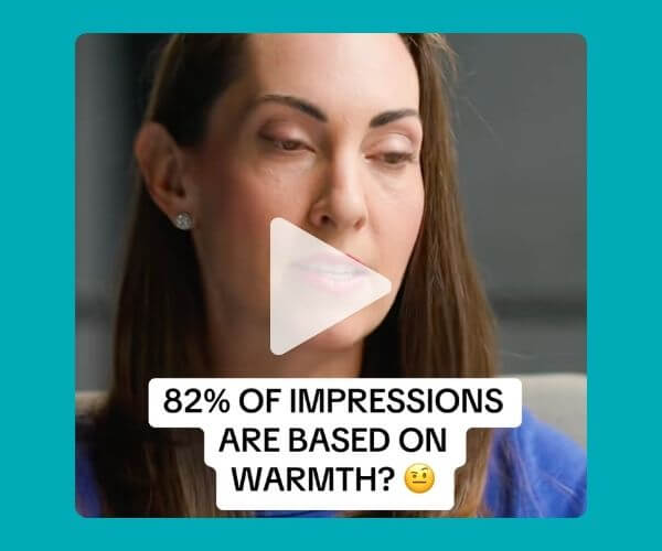 A video-style image with a teal background shows a close-up of a brunette woman looking toward the camera. A white text box reads, “82% of impressions are based on warmth?” with a translucent play button over the center.