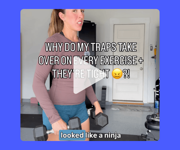 A woman holds two dumbbells while standing in a room with exercise equipment. Text over the video reads, “WHY DO MY TRAPS TAKE OVER ON EVERY EXERCISE + THEY’RE TIGHT?!” and “looked like a ninja.”